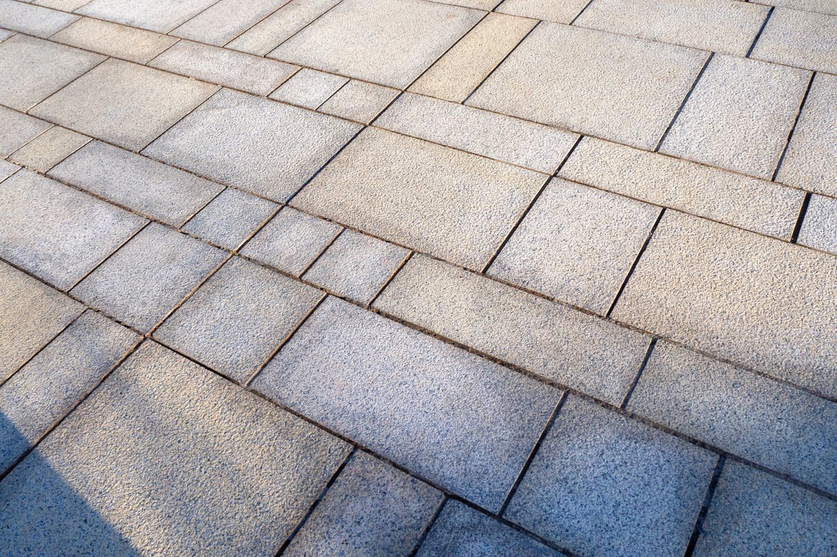 Textured paver tiles arranged in a diagonal pattern, showcasing a clean and modern aesthetic