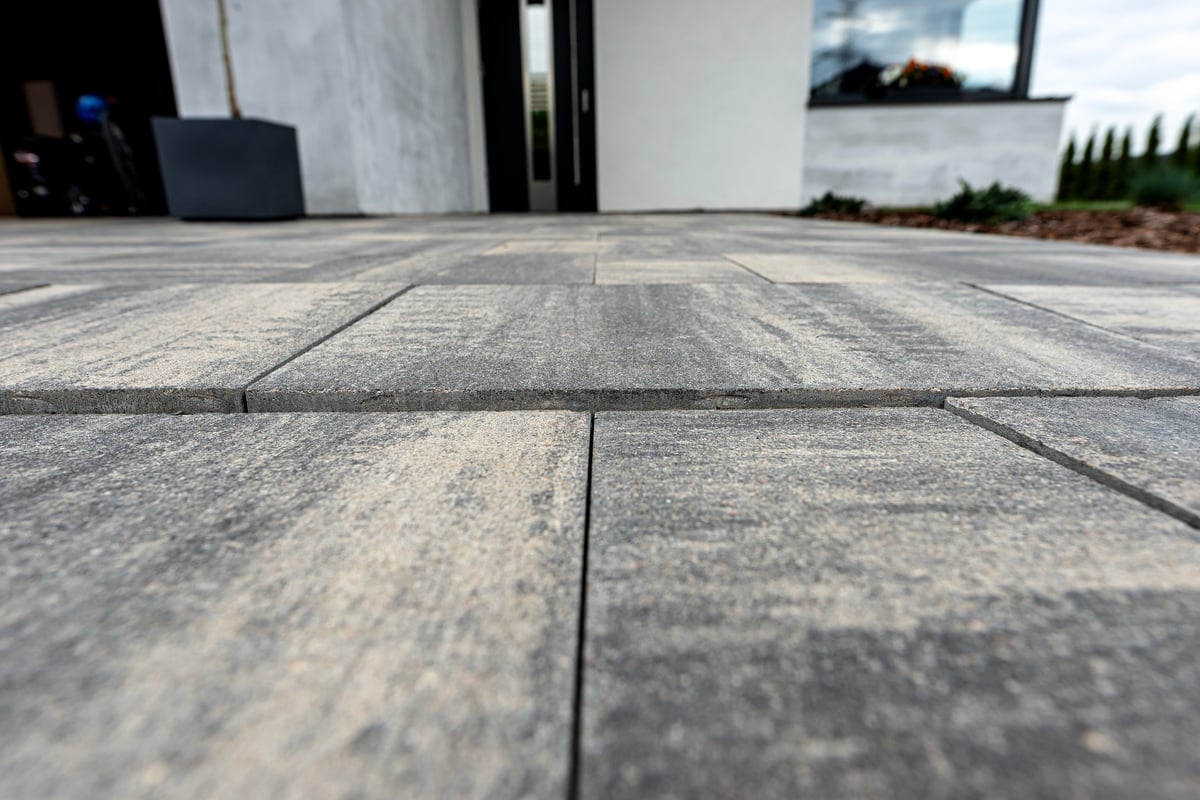 Interlocking paving stones in a modern home's front yard